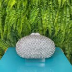 CLUTCH OVAL FLOR MADREPEROLA PRATA