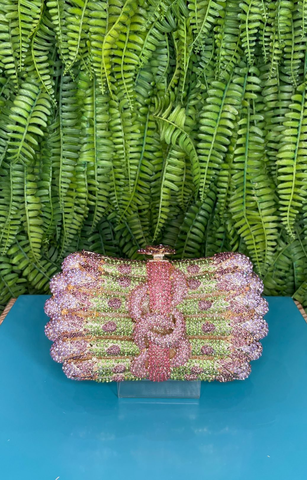 CLUTCH SWAROVISK LAÇO VERDE E ROSA